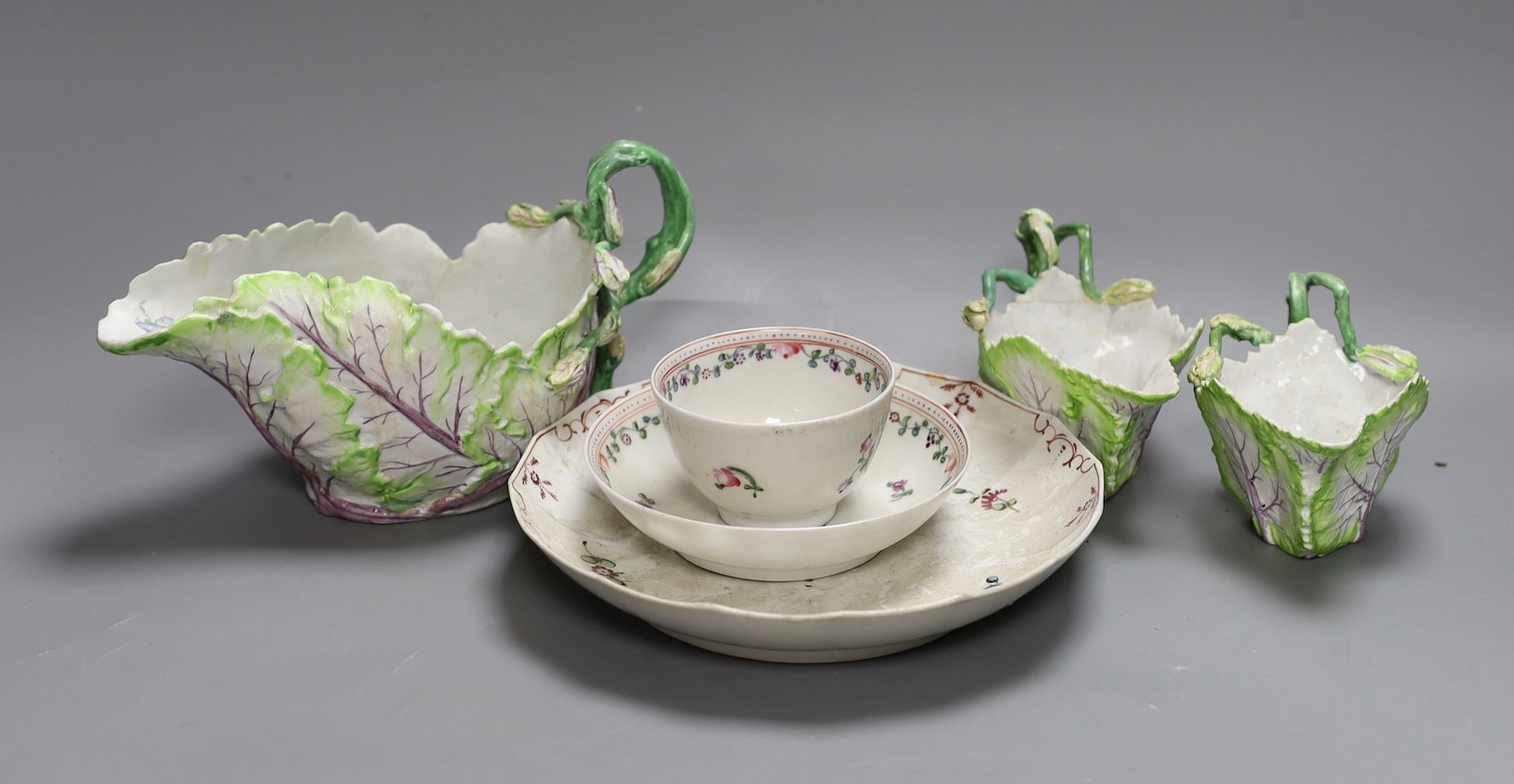 A Longton Hall cabbage leaf sauceboat and two similar creamboats, c.1755, faults and Newhall type tea wares, largest jug 22 cms wide